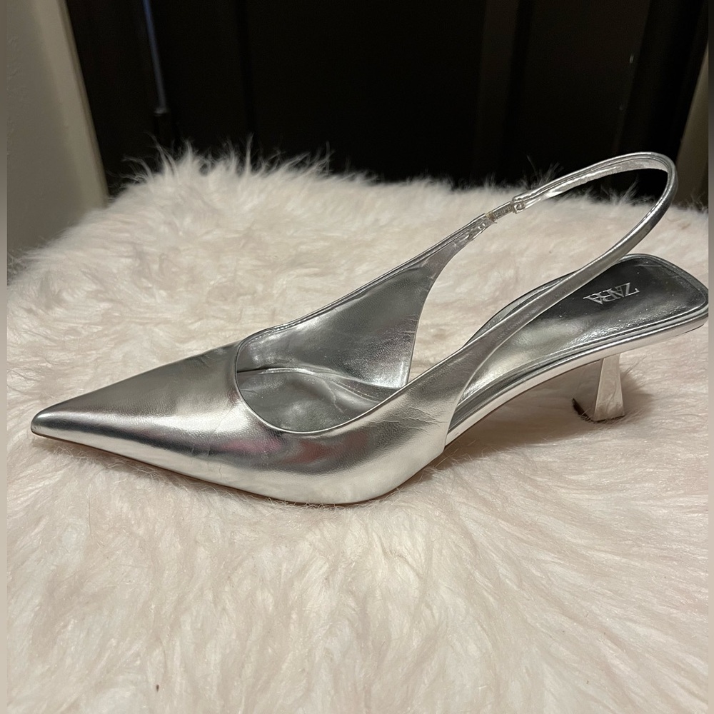 Metallic silver pointed toe heels